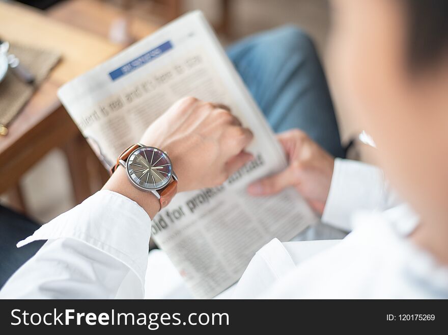 Time Keeping For Important Appointment, A Man Looks On His Watch