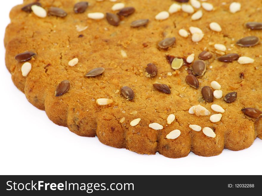 Shortcake with kernels of fried nutlets and sunflower seeds. Selective focus. Shortcake with kernels of fried nutlets and sunflower seeds. Selective focus.