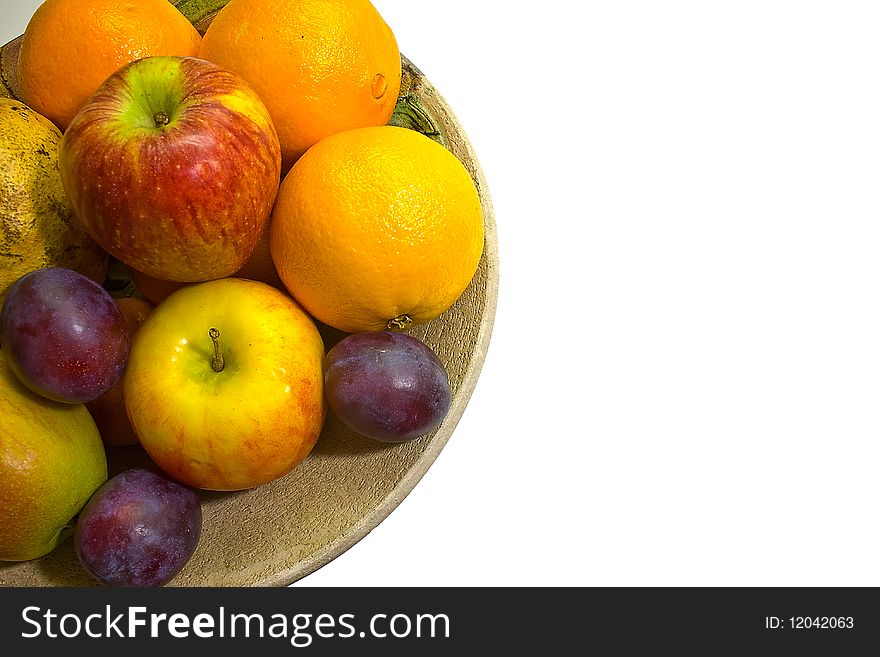 A half dish of fruits with nice white background