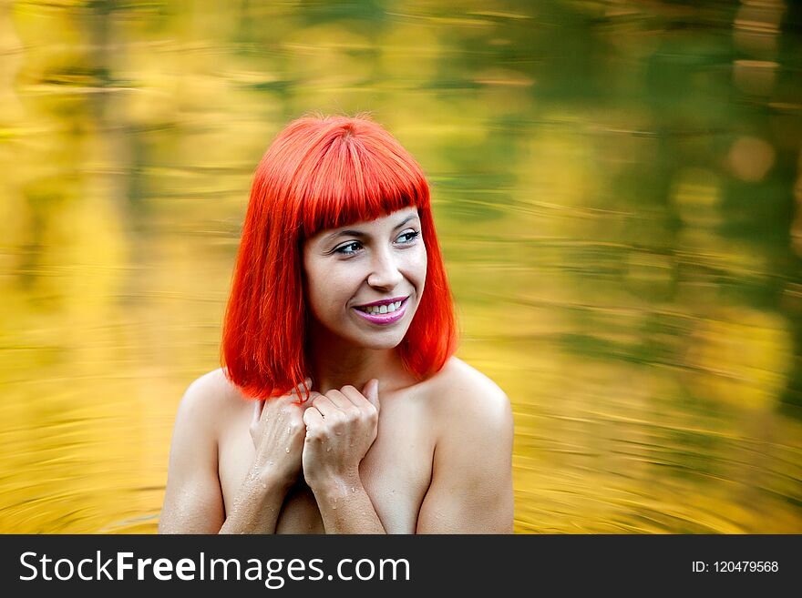 Happy Girl With Red Hair On A Lake Without Clothes