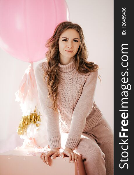 Photo of beautiful young woman with big balloons