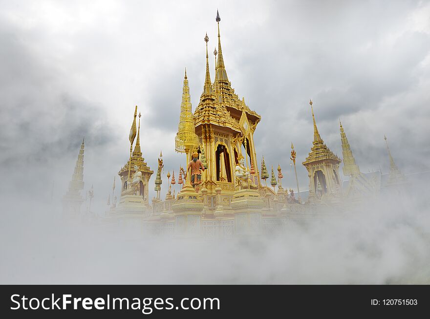 Beautiful golden royal crematorium of beloved Thai king in the clouds on the heaven