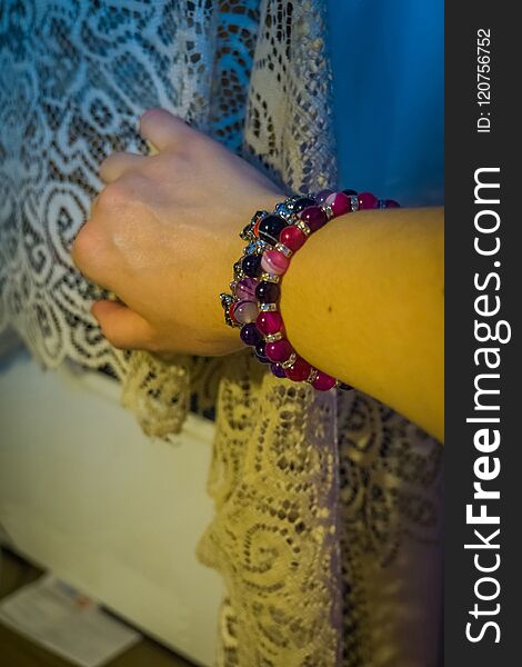 Natural stone agate beaded bracelets on female hand. Natural stone agate beaded bracelets on female hand.