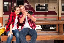 Happy Young Couple travellers Together On Vacation Taking A Photo At The Train Station, Travel Concept, Couple Concept Royalty Free Stock Image Happy Young Couple travellers Together On Vacation Taking A Photo At The Train Station, Travel Concept, Couple Concept Royalty Free Stock Image