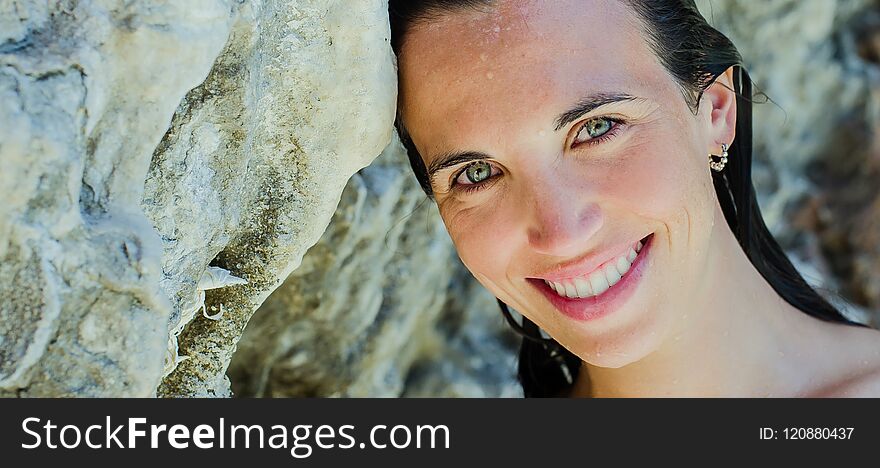 young woman on the beach, wild and beautiful