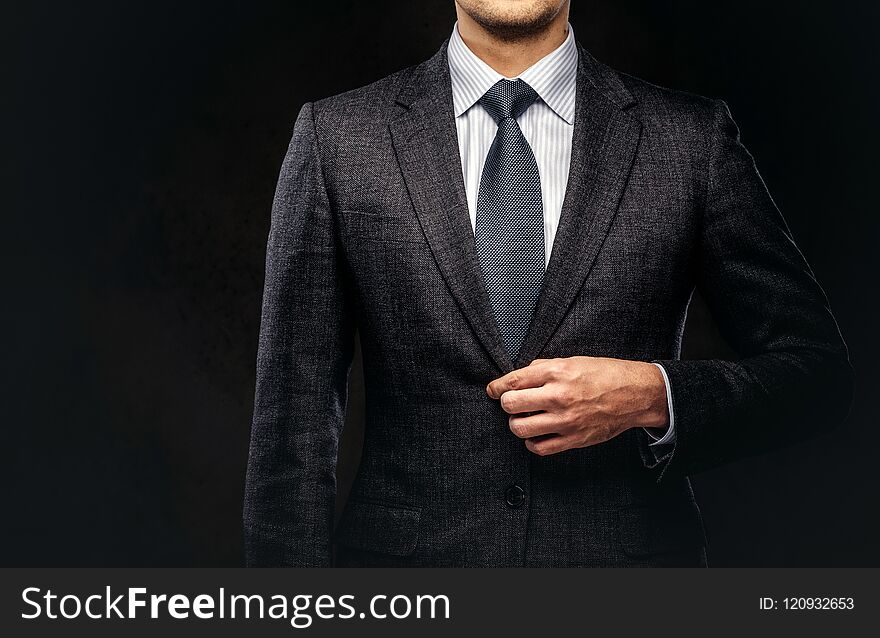 Cropped Portrait Of A Successful Businessman Dressed In An Elegant Formal Suit.