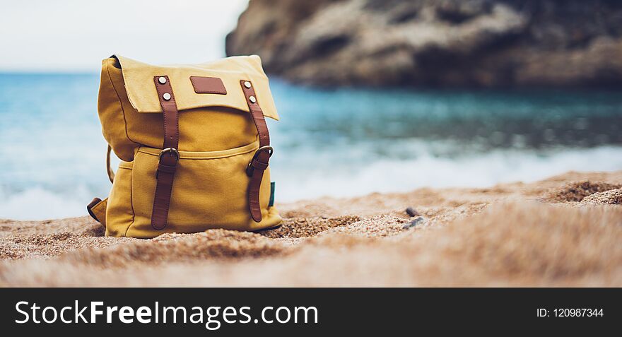 Hipster swimming mask on background blue sea ocean horizon, hiker tourist yellow backpack on sand beach, blurred panoramic seascape blank, traveler relax holiday concept, sunlight view in trip vacation