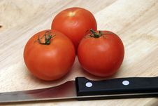 Tomatoes And Knife Stock Photography