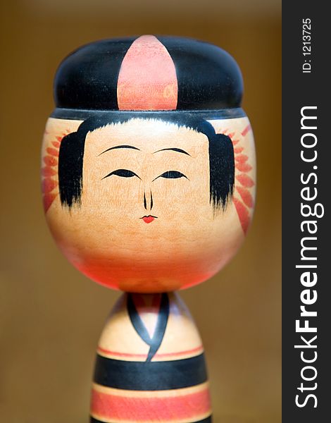 Details of a Japanese kokeshi wooden doll.