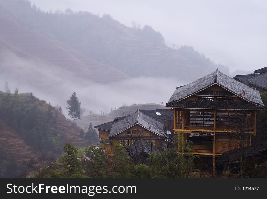 Traditional wooden house on top of terrace, China. Traditional wooden house on top of terrace, China