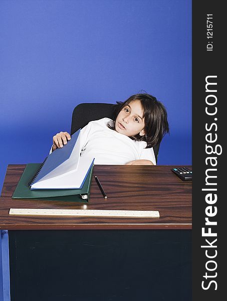 Little girl sitting in bad posture