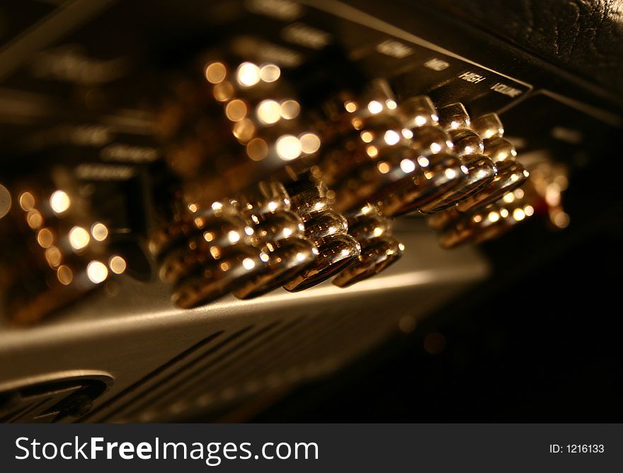 Shiny amber knobs on amplifier