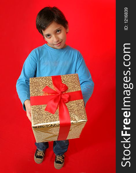 Cute boy with a christmas gift (series)