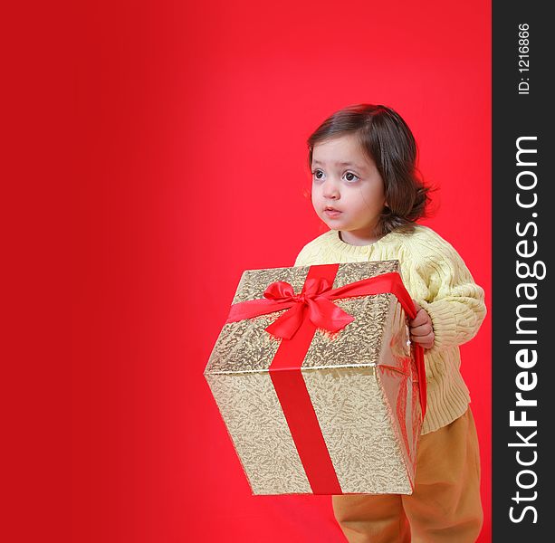 Cute little girl with a christmas gift (series). Cute little girl with a christmas gift (series)