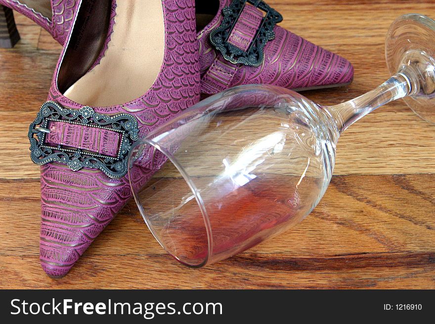Shoes with a windglass on floor. Shoes with a windglass on floor