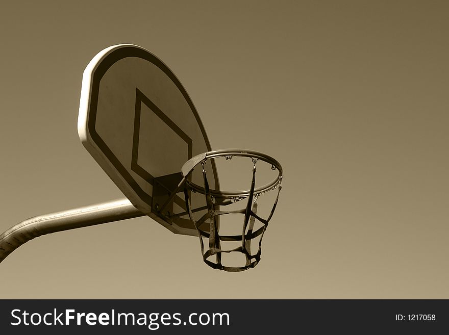 A picture of a basketball hoop in the park