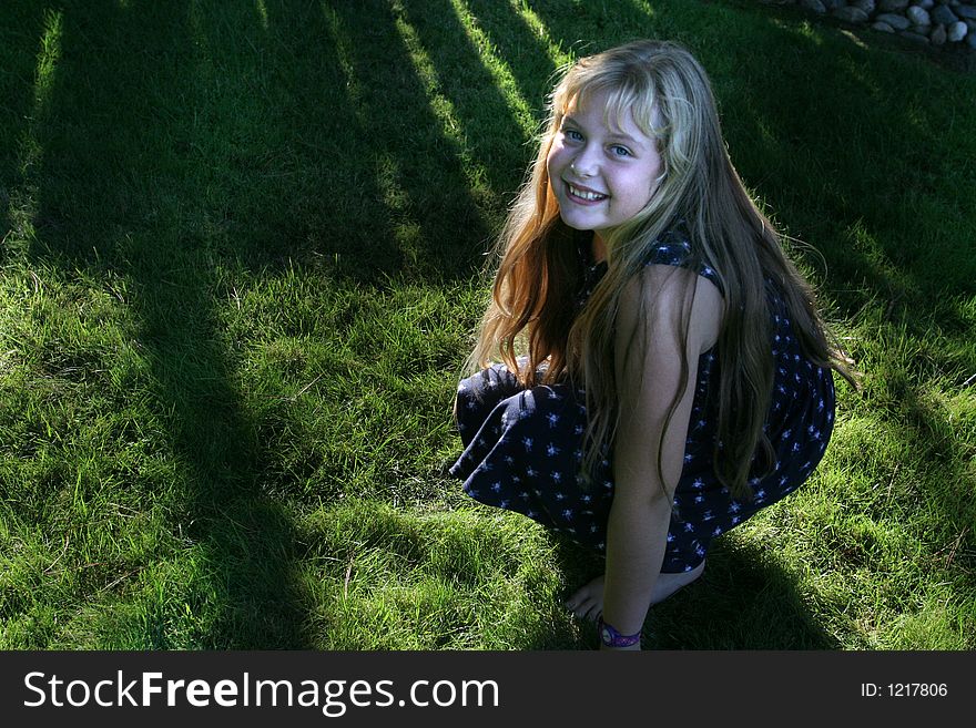Pretty little girl on green grass. Pretty little girl on green grass