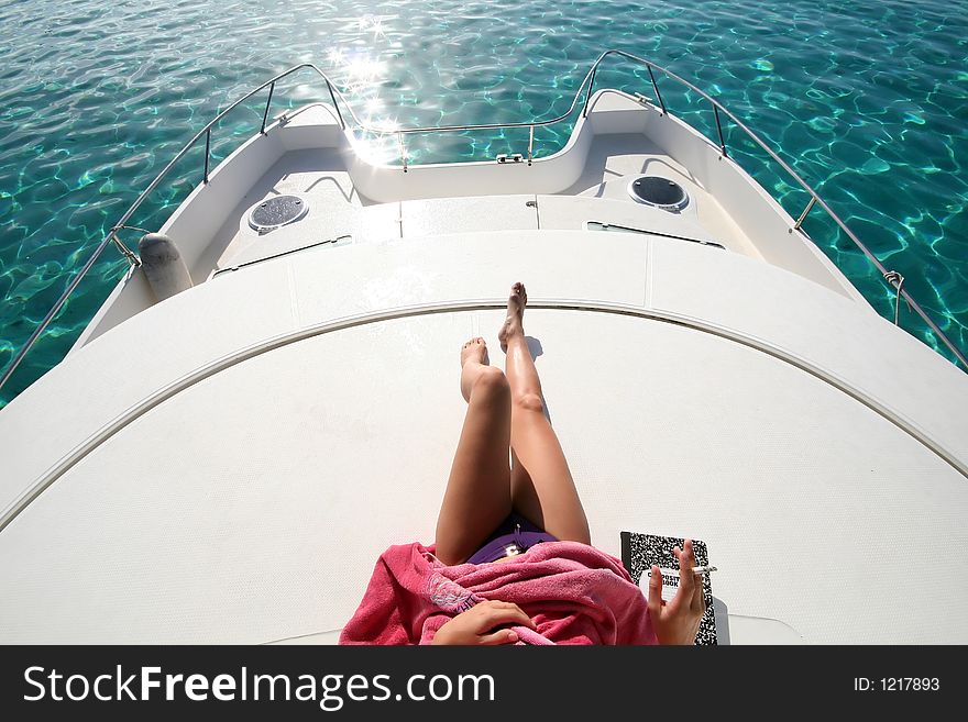 Woman Legs On A Boat