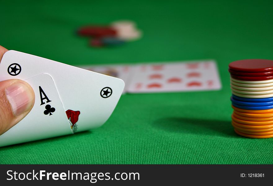 Cards held by fingers showing a royal flush. Cards held by fingers showing a royal flush