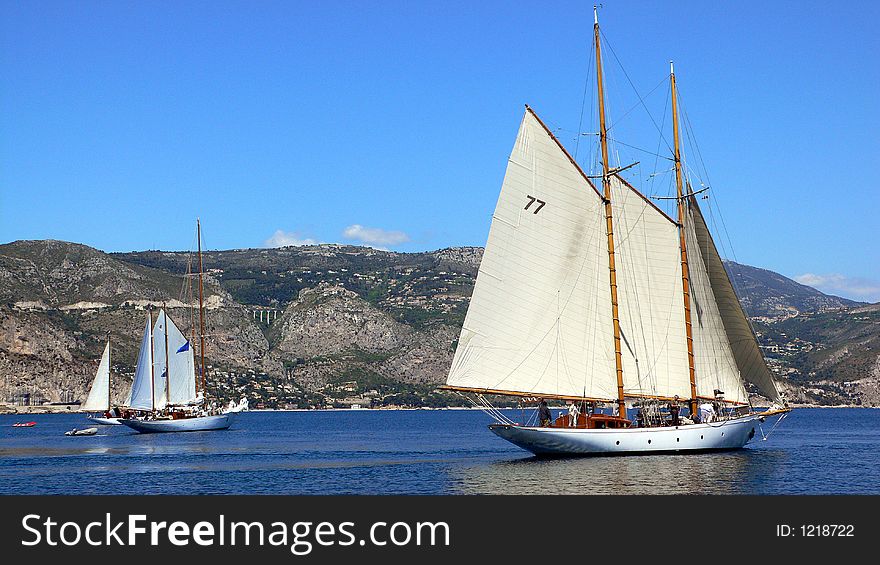 Classic sailing yachts preparing for departure in a bay. Classic sailing yachts preparing for departure in a bay