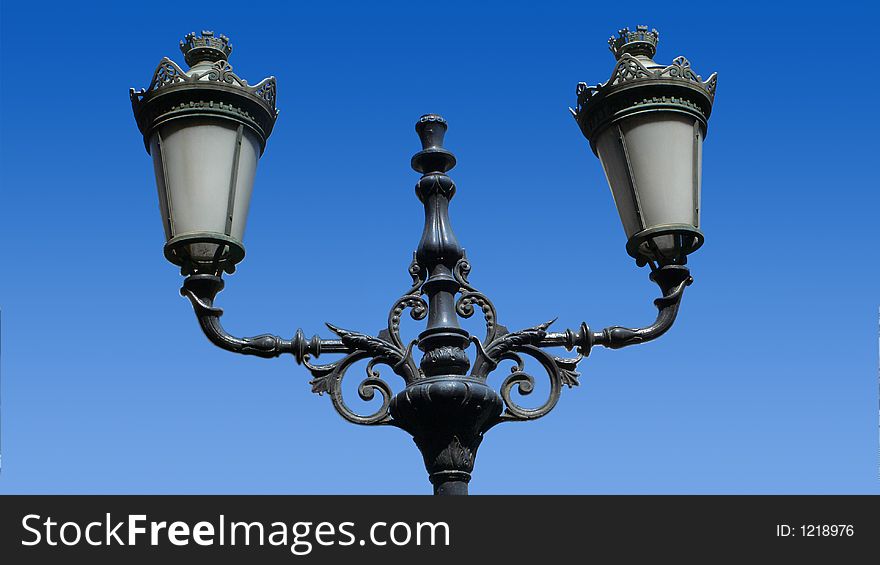 Double wrought iron art-deco street lanterns in the old town of nice. Double wrought iron art-deco street lanterns in the old town of nice