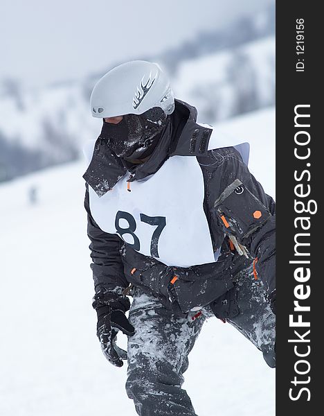 Snowboarder racer portrait in helmet and mask. Snowboarder racer portrait in helmet and mask