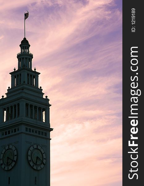 Silhoutte of a clock tower against sunset sky