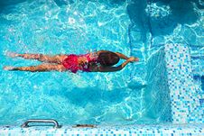 Little Girl Swimming In The Pool Royalty Free Stock Photo