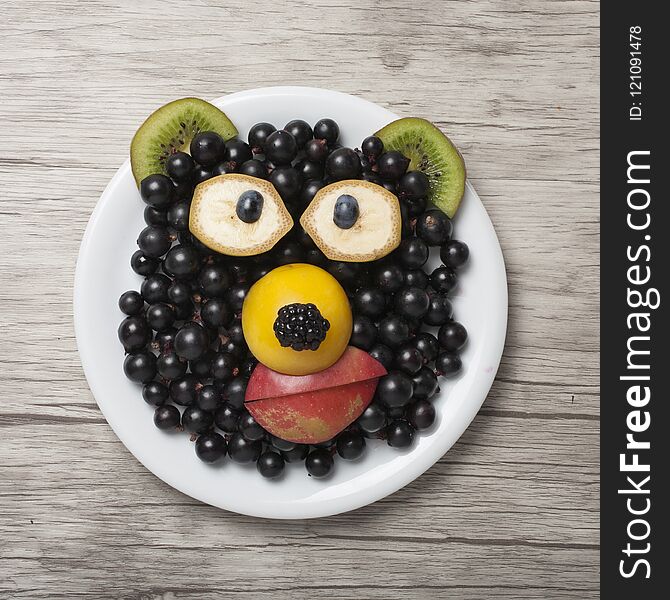 Funny bear made with currant, kiwi and apple