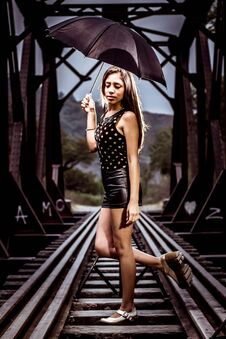 Woman Posing On Railroad Tracks Stock Photography