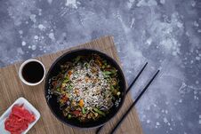 Buckwheat Noodles With Meat And Vegetables, Asian Wok On A Gray Royalty Free Stock Photography