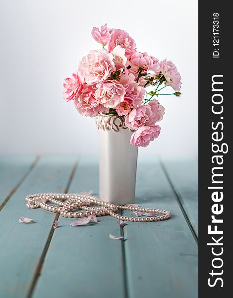 Vase With Beautiful Pink Flowers On Table.