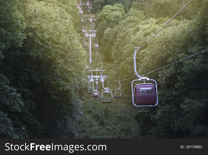 Image Of A Cable Car In The Mountains Running Through A Forest G