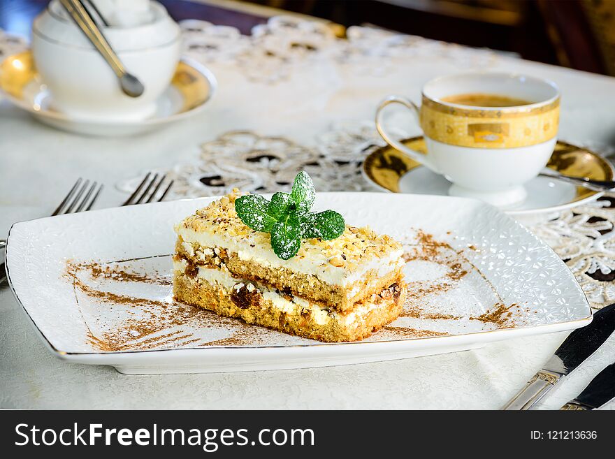 Sweet cheesecake dessert with mint in a plate new menu from the pastry chef