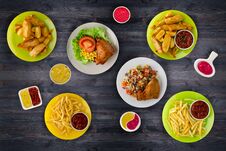 Junk Food . Fast Food. French Fries, Leg, Sauces On The Table Stock Photo
