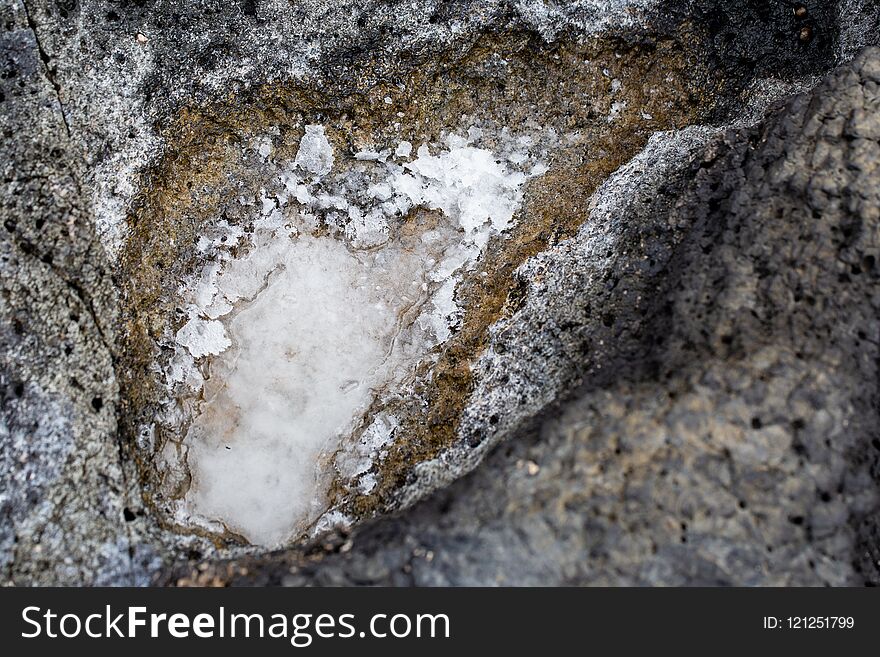 Small Sea Salt Concentrate Puddle On Rocky Ground