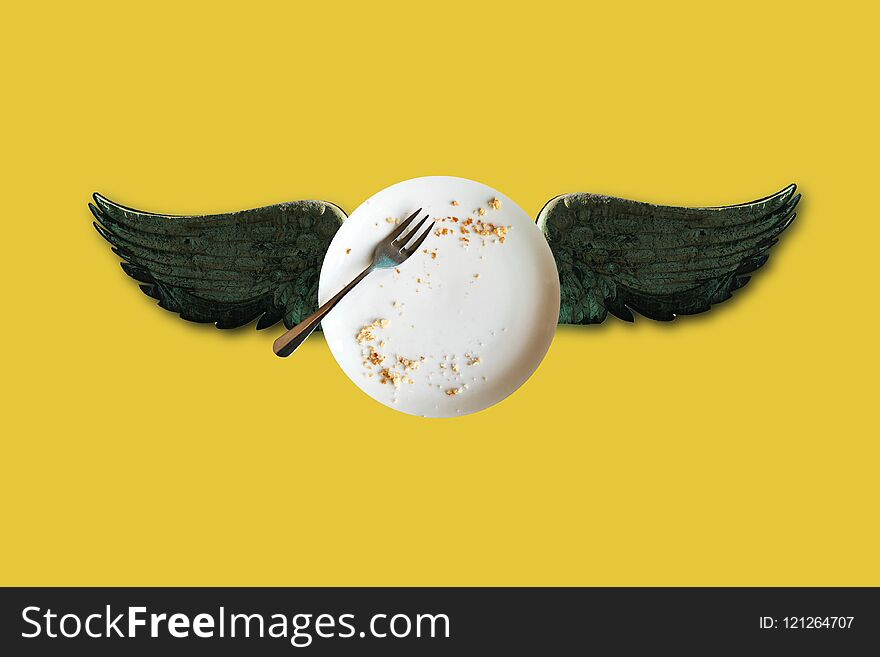Minimal conceptual illustration of an empty plate with crumbs and wings on a yellow background. My idea, design and art