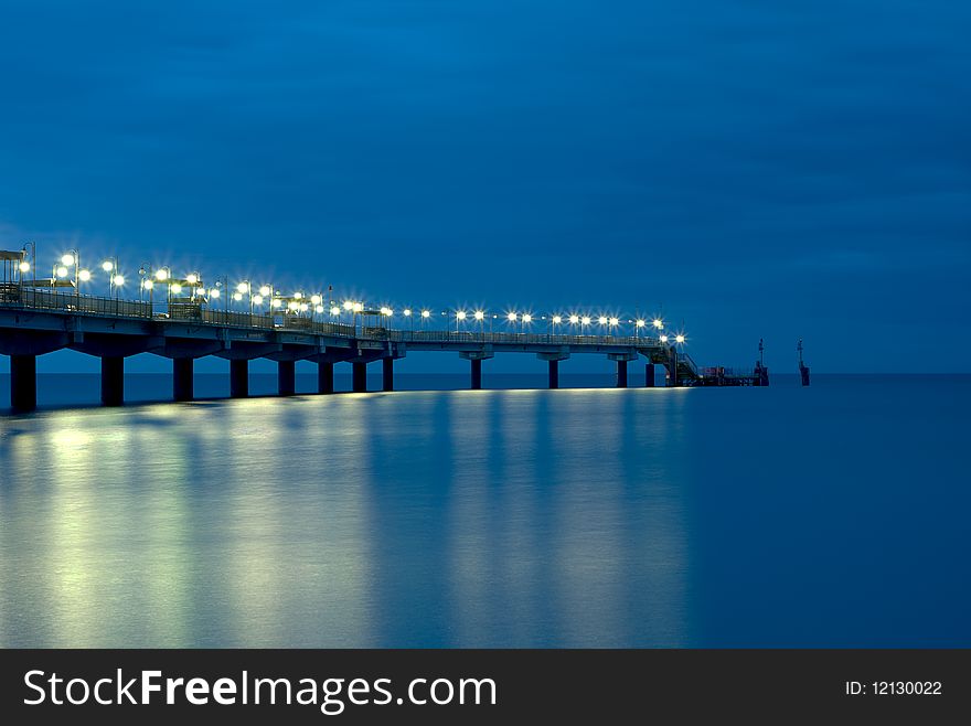 Lighted Polish pier at twilight. Lighted Polish pier at twilight