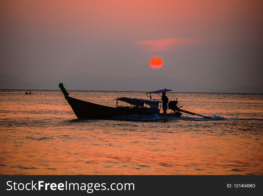 Picture of typical fisher man boat in sunset. Krabi. Thailand