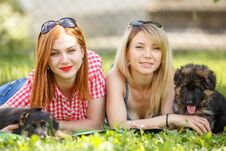Two Young Women With Puppies Of German Shepherd Royalty Free Stock Images Two Young Women With Puppies Of German Shepherd Royalty Free Stock Images
