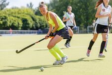 Young Hockey Player Woman With Ball In Attack Stock Photos Young Hockey Player Woman With Ball In Attack Stock Photos