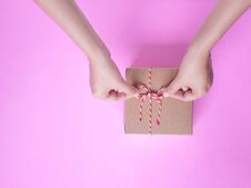 Female Hands Bow Tie A Simple Craft Paper Gift Box Wrapped Stock Photography Female Hands Bow Tie A Simple Craft Paper Gift Box Wrapped Stock Photography