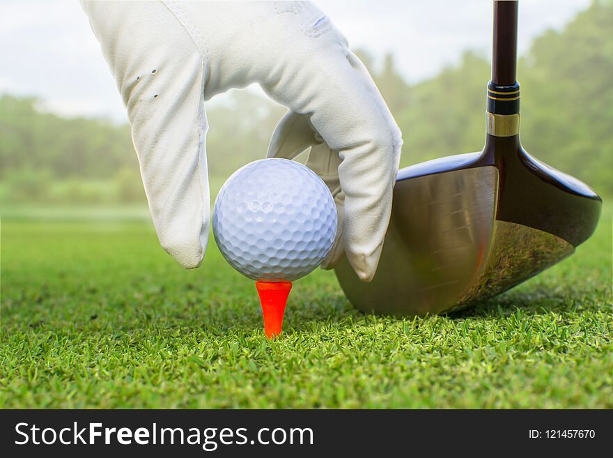 Golf clubs and golf balls putt on red tee. Golf clubs and golf balls putt on red tee.