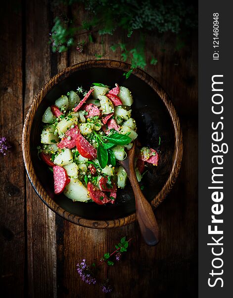 Italian potato and salami salad.style rustic. selective focus