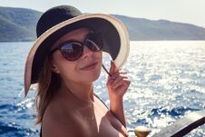 Beautiful Girl In Hat Relaxing On The Boat And Looking At The Is Stock Images