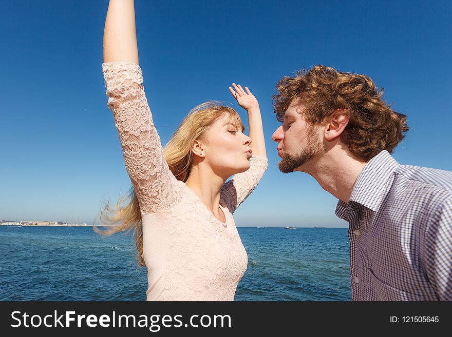 Happiness dating concept. Couple in love blonde women handsome bearded men enjoy romantic date kissing, outdoor wide angle view. Happiness dating concept. Couple in love blonde women handsome bearded men enjoy romantic date kissing, outdoor wide angle view