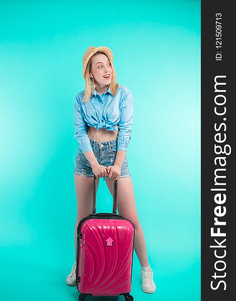 Full length portrait of blond excited girl making a journey. business trip. wait for taxi. tourist is going to exotic countries. Full length portrait of blond excited girl making a journey. business trip. wait for taxi. tourist is going to exotic countries