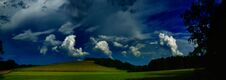 Scenic Landscape With Storm Cloud In Background Over Green Agriculture Fields Royalty Free Stock Photos