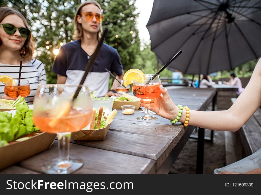 Friends Having Fun At The Park Cafe Outdoors