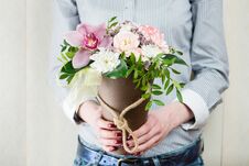 Flower Arrangement In A Box-cone With Fresh Flowers In Female Ha Stock Photos